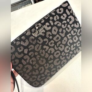 Practically new Kate Spade wristlet in black/silver leopard print